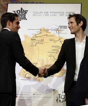 Alberto Contador greets rival Frank Schleck at Tour 2012 route presentation