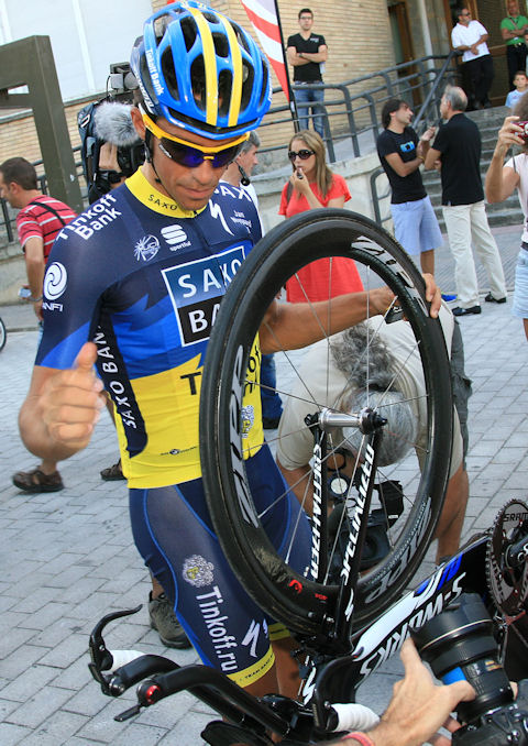 Alberto goes over his bike with a fine-toothed comb